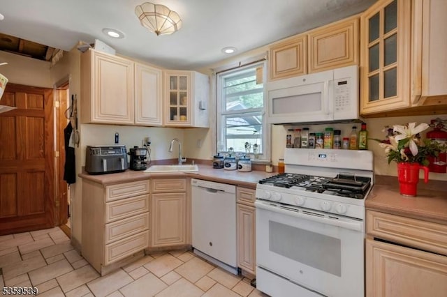 139 Pine Grove Ter, Newark City, NJ 07106 - kitchen featuring white appliances, a sink, light countertops, glass insert cabinets, and recessed lighting