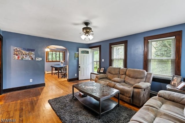 27 Wertsville Rd, East Amwell Twp, NJ 08551 - living area featuring wood finished floors, plenty of natural light, ceiling fan, and arched walkways