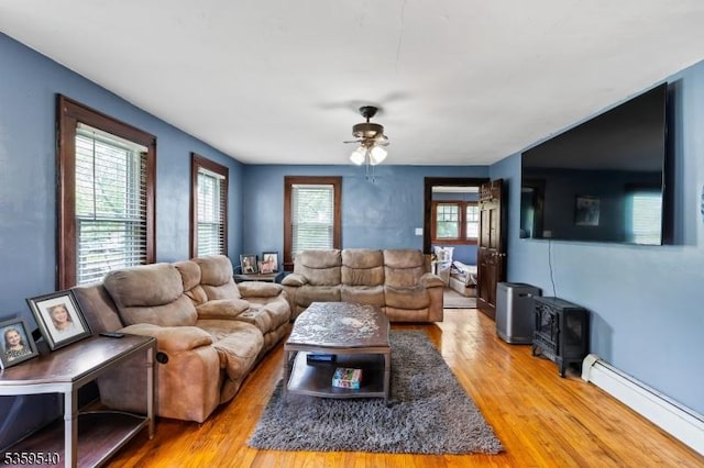 27 Wertsville Rd, East Amwell Twp, NJ 08551 - living area featuring a baseboard heating unit, wood finished floors, and ceiling fan