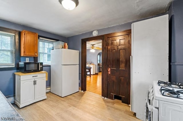 27 Wertsville Rd, East Amwell Twp, NJ 08551 - kitchen featuring white appliances, light wood-type flooring, and a ceiling fan