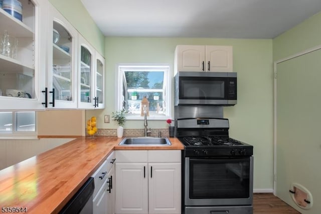 3 Cumberland Rd, Hillsborough Twp, NJ 08844 - kitchen with stainless steel appliances, a sink, wooden counters, and white cabinets