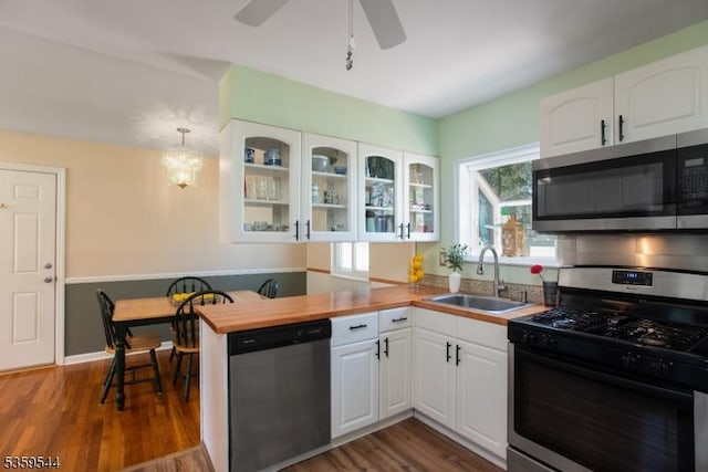 3 Cumberland Rd, Hillsborough Twp, NJ 08844 - kitchen featuring stainless steel appliances, a sink, white cabinetry, and glass insert cabinets