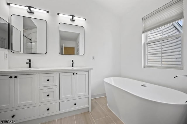 256 Marcia Way, Bridgewater Twp, NJ 08807 - full bathroom with double vanity, a freestanding bath, baseboards, and a shower