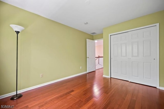 256 Marcia Way, Bridgewater Twp, NJ 08807 - unfurnished bedroom with wood finished floors, baseboards, and a closet