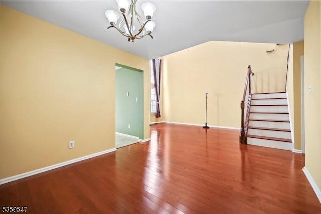 256 Marcia Way, Bridgewater Twp, NJ 08807 - spare room with a chandelier, wood finished floors, stairway, and baseboards