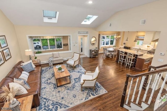 55 Nomahegan Ct, Cranford Twp, NJ 07016 - living room featuring a skylight, lofted ceiling, dark wood-style flooring, and baseboard heating