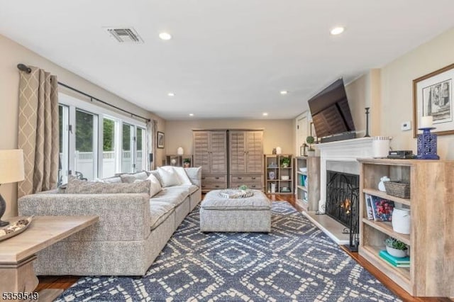 55 Nomahegan Ct, Cranford Twp, NJ 07016 - living area featuring a warm lit fireplace, wood finished floors, and recessed lighting