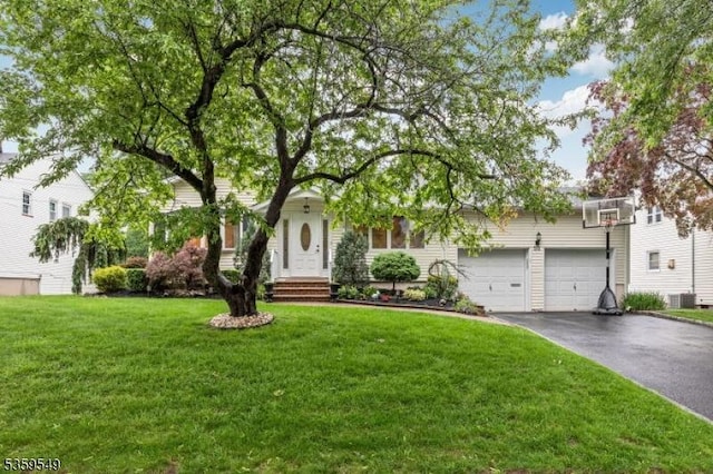 55 Nomahegan Ct, Cranford Twp, NJ 07016 - obstructed view of property with asphalt driveway, a front lawn, a garage, and central AC unit