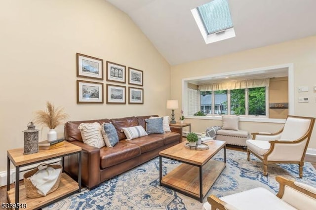 55 Nomahegan Ct, Cranford Twp, NJ 07016 - living room with a skylight, wood finished floors, baseboards, and high vaulted ceiling