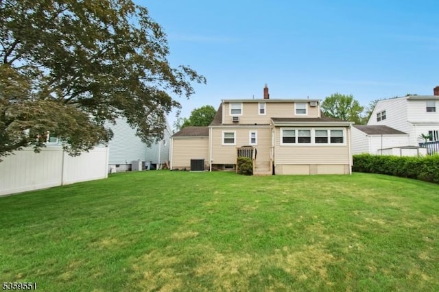 184 Locust Dr, Union Twp, NJ 07083 - rear view of house featuring a chimney and central AC