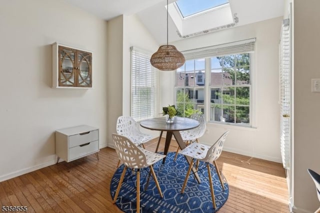 3 Merchant Ct, Bernards Twp, NJ 07920 - dining space with a skylight, wood-type flooring, baseboards, and lofted ceiling