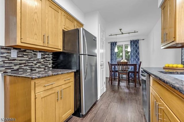 23 Bond St, Bridgewater Twp, NJ 08807 - kitchen with appliances with stainless steel finishes, dark wood-type flooring, tasteful backsplash, and dark stone countertops