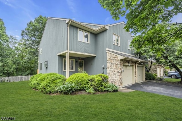 23 Bond St, Bridgewater Twp, NJ 08807 - view of front of property with driveway, a garage, and stone siding