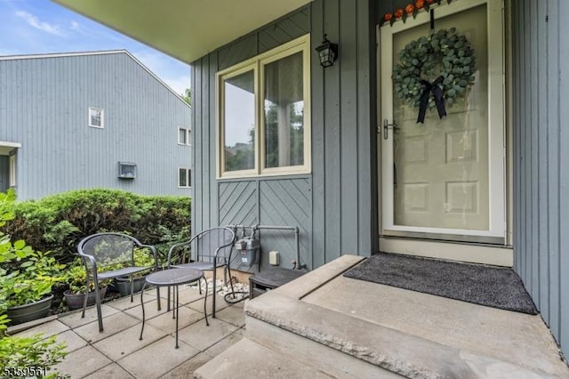 23 Bond St, Bridgewater Twp, NJ 08807 - doorway to property featuring board and batten siding