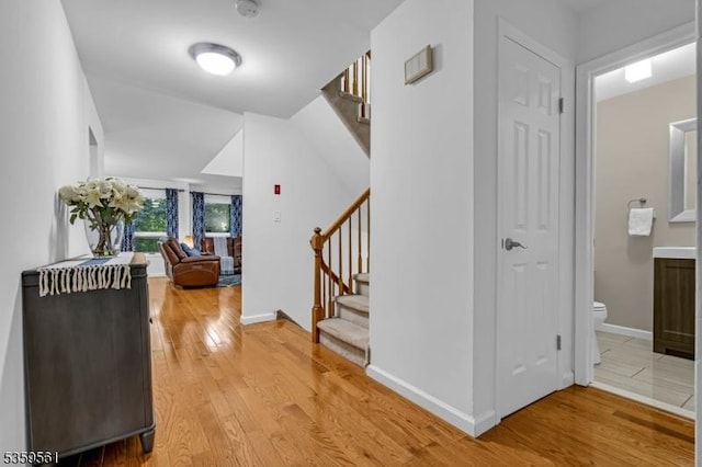 23 Bond St, Bridgewater Twp, NJ 08807 - hallway with stairway and light wood-style floors