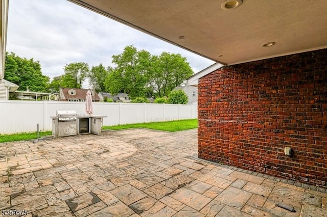 300 Jefferson Ave, Rahway City, NJ 07065 - fenced backyard with a patio and grilling area
