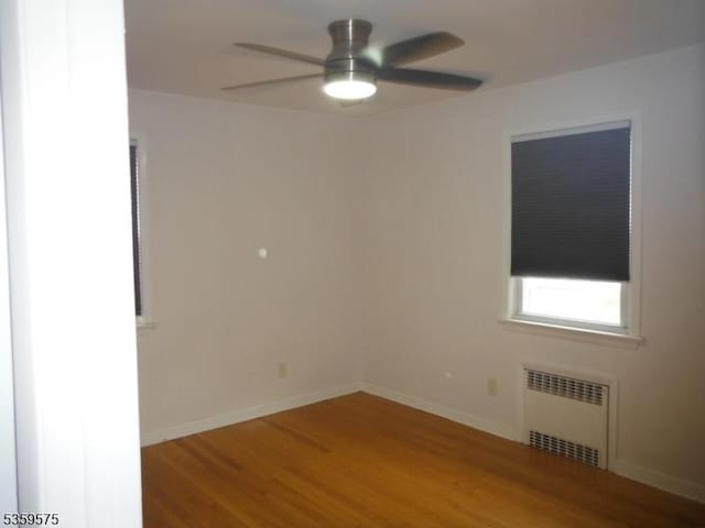 300 Jefferson Ave, Rahway City, NJ 07065 - spare room with radiator heating unit, wood finished floors, ceiling fan, and baseboards
