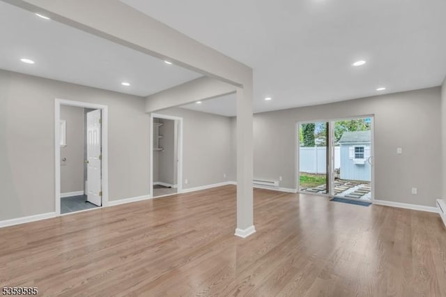 10 Rutgers Way, Hopatcong Boro, NJ 07843 - unfurnished living room with light wood finished floors, baseboards, a baseboard radiator, and recessed lighting