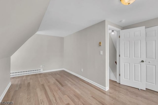10 Rutgers Way, Hopatcong Boro, NJ 07843 - bonus room with a baseboard radiator, wood finished floors, lofted ceiling, and baseboards