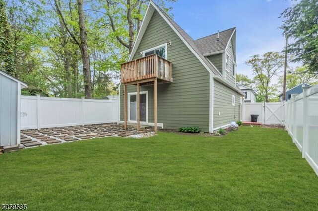 10 Rutgers Way, Hopatcong Boro, NJ 07843 - rear view of house with roof with shingles, a balcony, and a gate