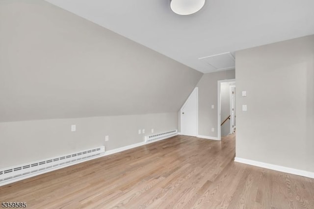 10 Rutgers Way, Hopatcong Boro, NJ 07843 - additional living space with baseboard heating, attic access, a baseboard radiator, wood finished floors, and lofted ceiling