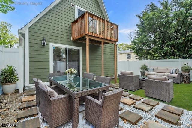10 Rutgers Way, Hopatcong Boro, NJ 07843 - fenced backyard featuring an outdoor living space, outdoor dining area, a balcony, and a patio
