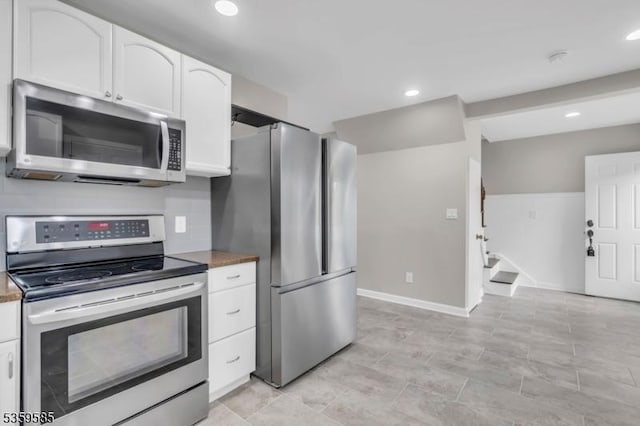 10 Rutgers Way, Hopatcong Boro, NJ 07843 - kitchen with appliances with stainless steel finishes, white cabinetry, recessed lighting, and baseboards
