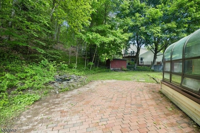 59 Old Croton Rd, Raritan Twp, NJ 08822 - view of patio featuring a sunroom and an outbuilding