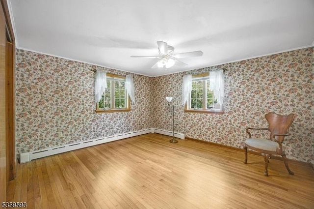 24 Jenkins Rd, Franklin Boro, NJ 07416 - spare room with wood finished floors, baseboards, wallpapered walls, a ceiling fan, and a baseboard heating unit