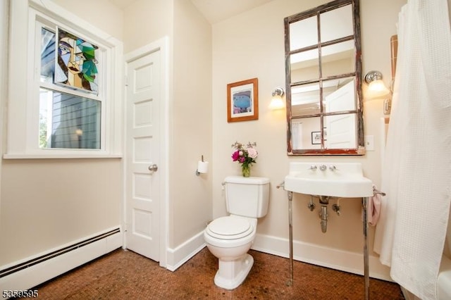 8 S Main St, Stockton Boro, NJ 08559 - bathroom featuring a baseboard heating unit, toilet, baseboards, and a sink