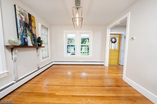 8 S Main St, Stockton Boro, NJ 08559 - unfurnished dining area featuring baseboard heating, light wood finished floors, and baseboards