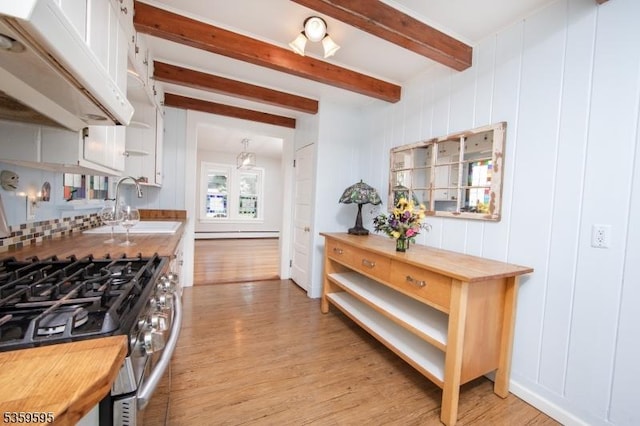 8 S Main St, Stockton Boro, NJ 08559 - kitchen featuring stainless steel gas range, butcher block countertops, light wood-style floors, beamed ceiling, and under cabinet range hood