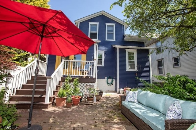 8 S Main St, Stockton Boro, NJ 08559 - back of property with an outdoor hangout area and a patio