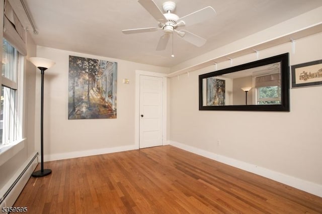 8 S Main St, Stockton Boro, NJ 08559 - unfurnished room featuring a baseboard heating unit, wood finished floors, ceiling fan, and baseboards