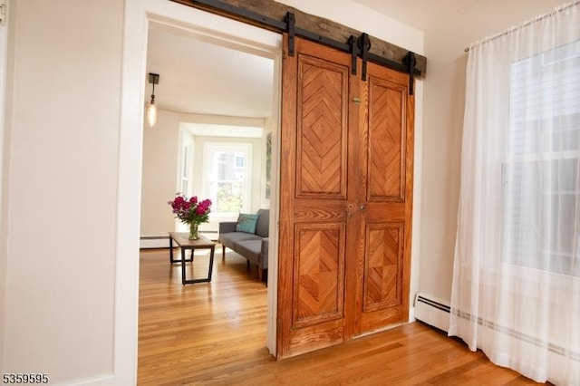 8 S Main St, Stockton Boro, NJ 08559 - hall featuring light wood finished floors, a baseboard radiator, and a barn door