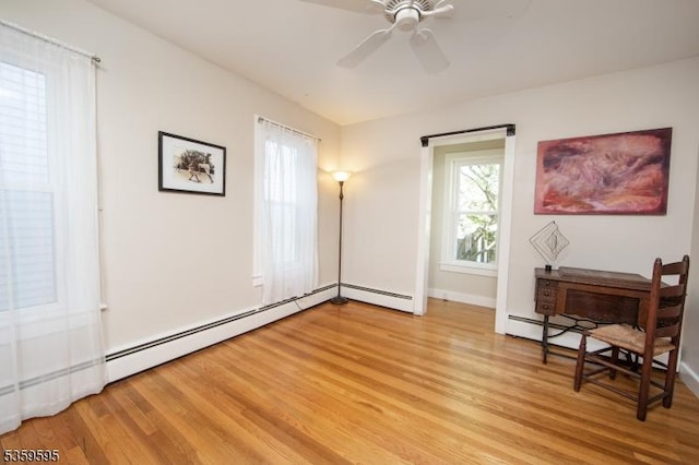 8 S Main St, Stockton Boro, NJ 08559 - sitting room with a baseboard radiator, light wood-type flooring, ceiling fan, and baseboards