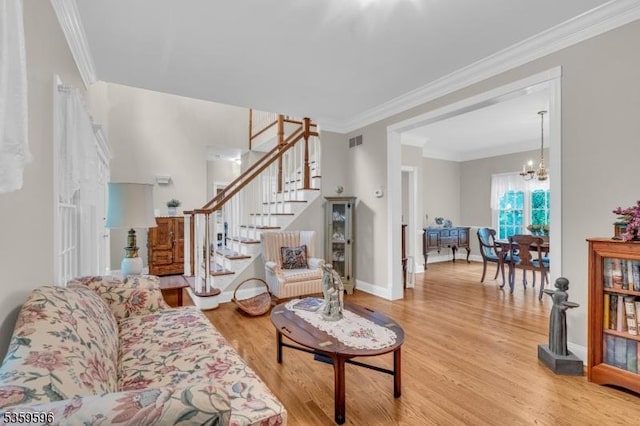 15 White Oak Dr, Union Twp, NJ 08802 - living room featuring wood finished floors, stairway, a chandelier, ornamental molding, and baseboards