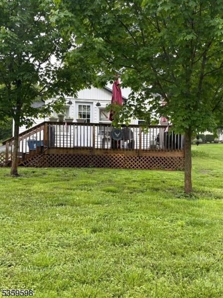 191 River Rd, Raritan Twp, NJ 08822 - view of green lawn with a deck