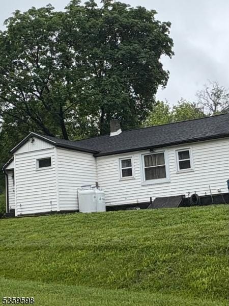191 River Rd, Raritan Twp, NJ 08822 - view of home's exterior with a lawn and a chimney