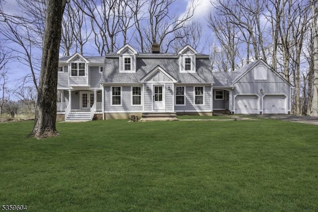 129 Sandy Ridge Rd, Delaware Twp, NJ 08559 - view of front of home with a chimney, a garage, a front yard, asphalt driveway, and french doors