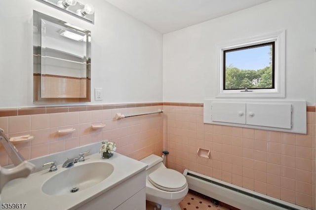 358 Princeton Rd, Union Twp, NJ 07083 - bathroom with tile walls, baseboard heating, toilet, vanity, and a wainscoted wall