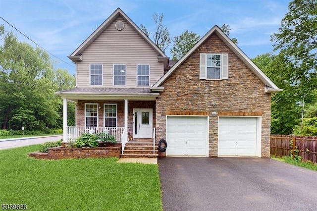 612 Magnolia Rd, North Brunswick Twp, NJ 08902 - view of front of home with driveway, stone siding, and a porch