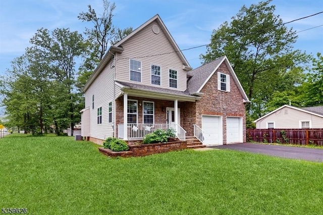 612 Magnolia Rd, North Brunswick Twp, NJ 08902 - view of front of property with a porch, stone siding, asphalt driveway, an attached garage, and central AC unit