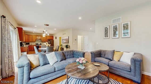 612 Magnolia Rd, North Brunswick Twp, NJ 08902 - living area featuring light wood-style flooring and recessed lighting