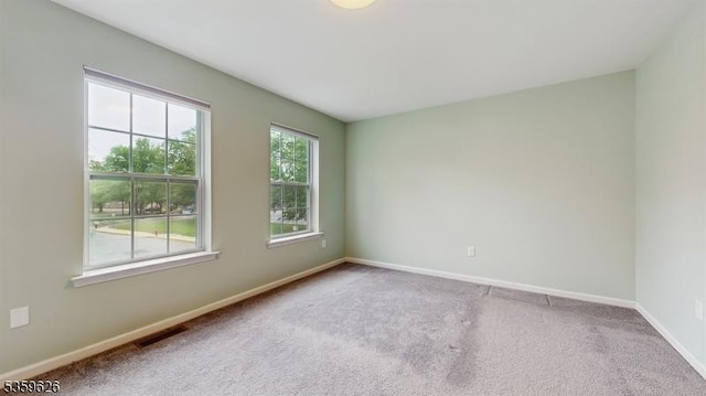 612 Magnolia Rd, North Brunswick Twp, NJ 08902 - carpeted empty room with baseboards