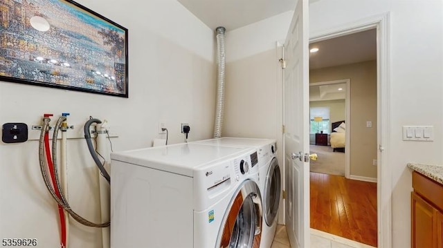 612 Magnolia Rd, North Brunswick Twp, NJ 08902 - washroom featuring washer and dryer, light wood finished floors, recessed lighting, and baseboards