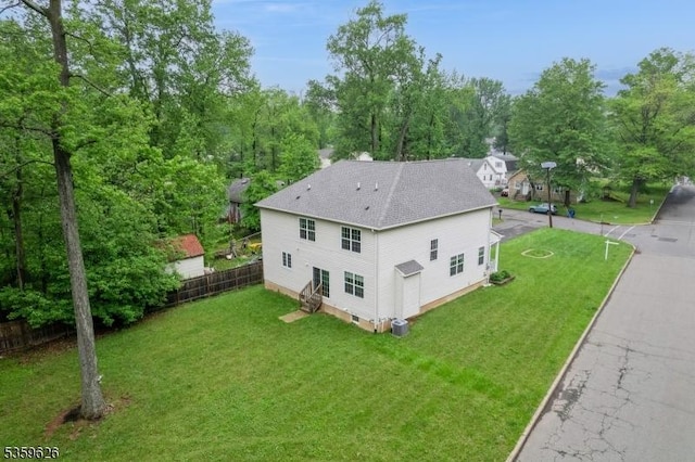 612 Magnolia Rd, North Brunswick Twp, NJ 08902 - view of home's exterior with a shingled roof and entry steps
