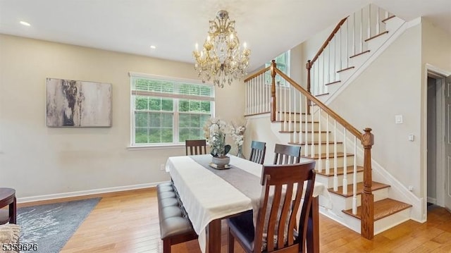 612 Magnolia Rd, North Brunswick Twp, NJ 08902 - dining space with light wood-style floors, a chandelier, stairs, baseboards, and recessed lighting