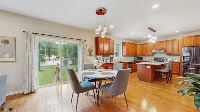 612 Magnolia Rd, North Brunswick Twp, NJ 08902 - dining space featuring light wood finished floors, plenty of natural light, recessed lighting, and baseboards