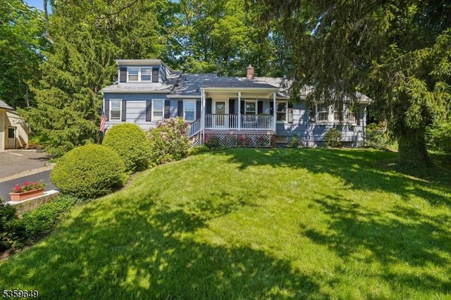 1794 Long Hill Rd, Long Hill Twp, NJ 07946 - view of front of home with a porch, a front lawn, and a chimney